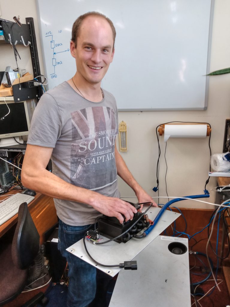 Max working at the climate-control box ‘GeoMIC’.